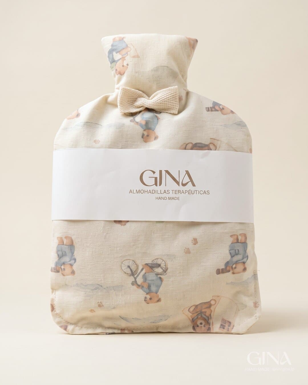The baby seed pouch in teddy-bear print linen with a bow and the GINA belly band.