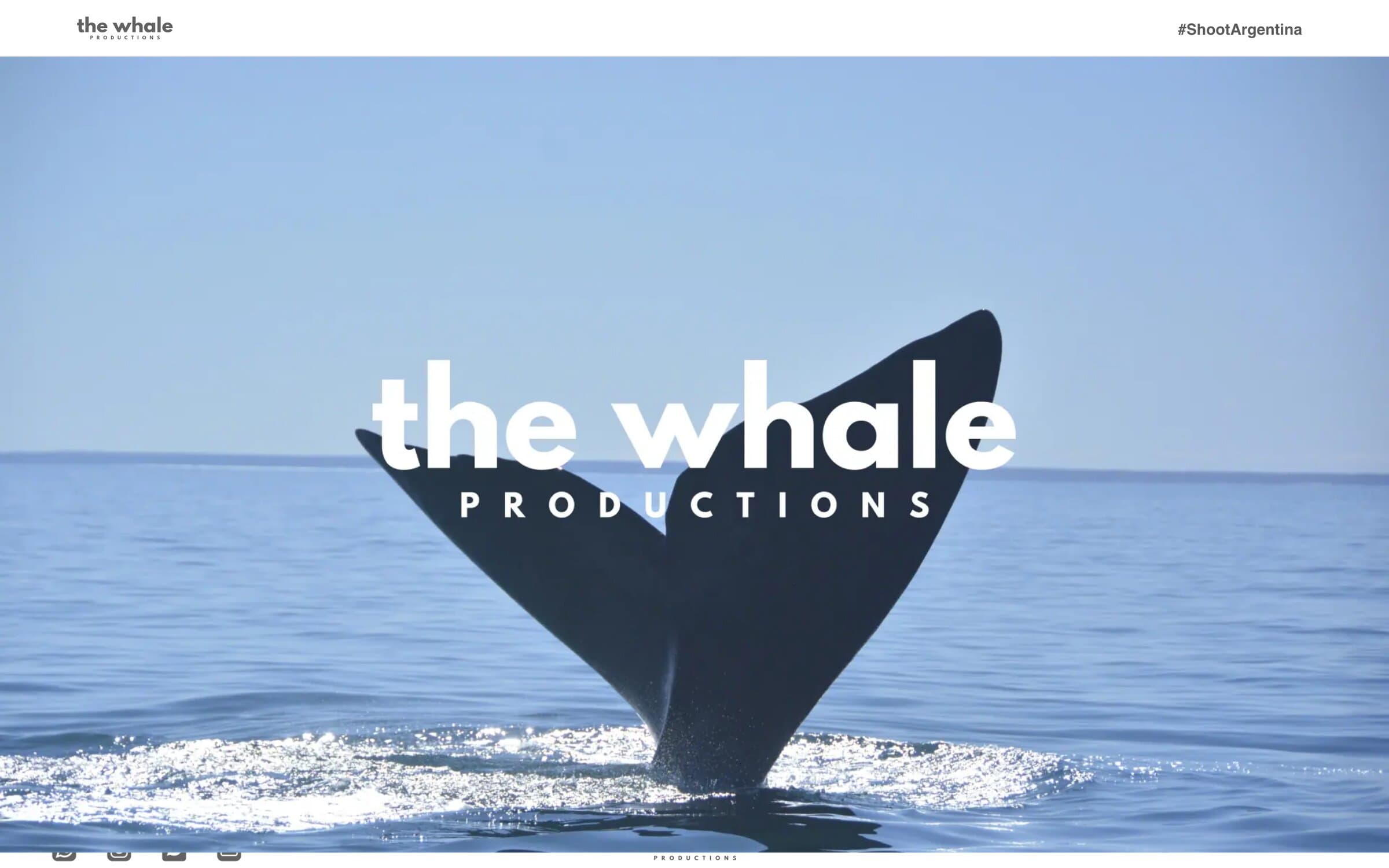 The Whale Productions home: the logo over a whale tail in the sea and the start of the grid of campaign stills.